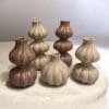 Kaarsenstandaard set in beige en brique kleur in drie hoogtes van 10, 15 en 20 cm